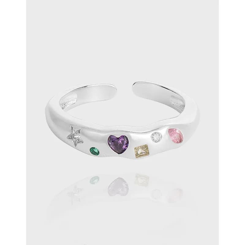 Polished sterling silver open-ring with multicolored gemstone accents.