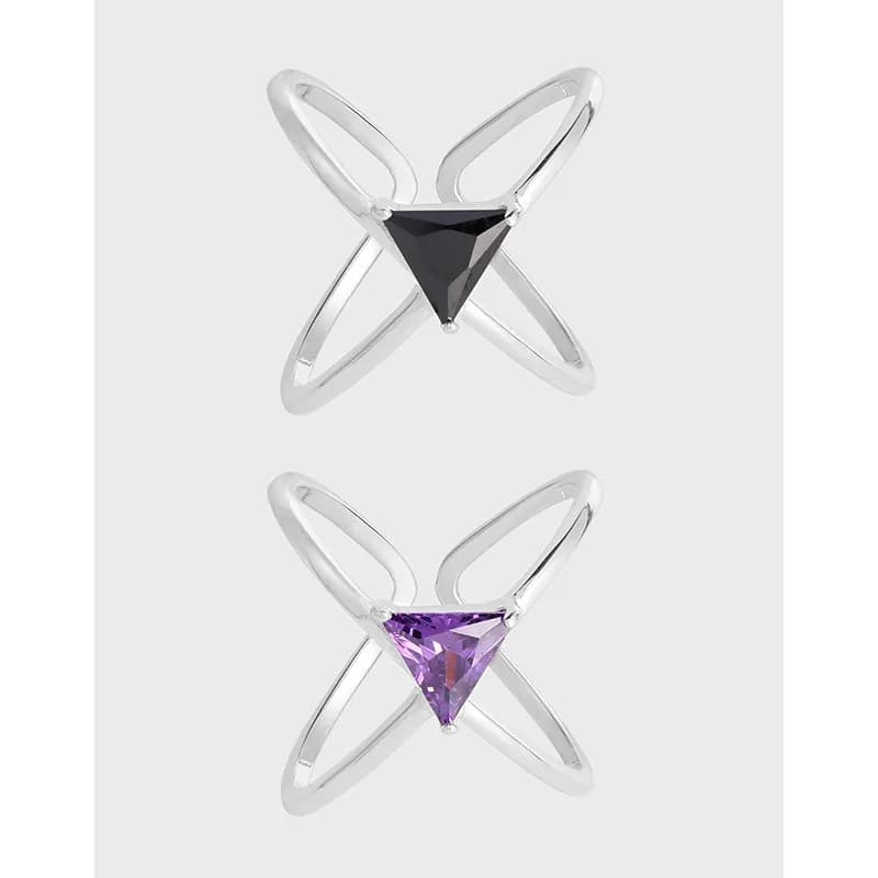 Two Sterling Silver X-cross rings featuring triangular black and purple gemstones