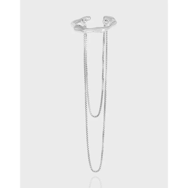 Polished sterling silver ear cuff with two dangling chain strands in a layered drape.
