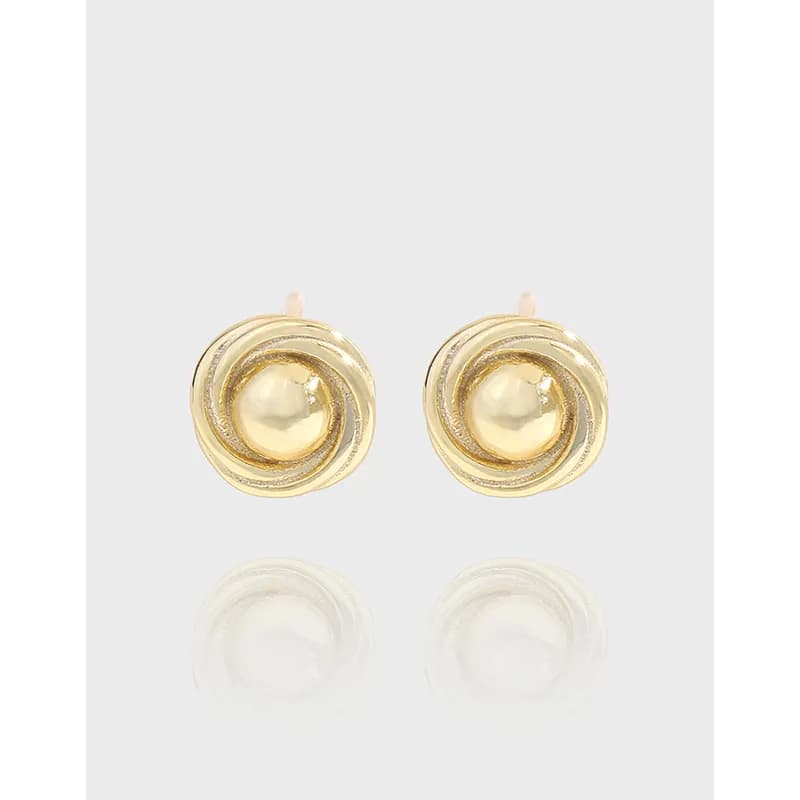 Pair of polished sterling silver spiral earrings with a central bead-like centerpiece.