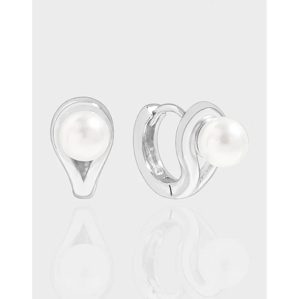 Polished sterling silver teardrop hoop earrings with a pearl accent shown on a light background.