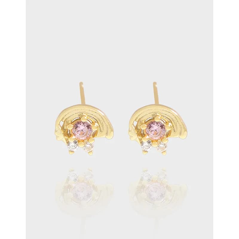 Polished crescent-shaped silver stud earrings with pink center stone and small clear accents on a white background.