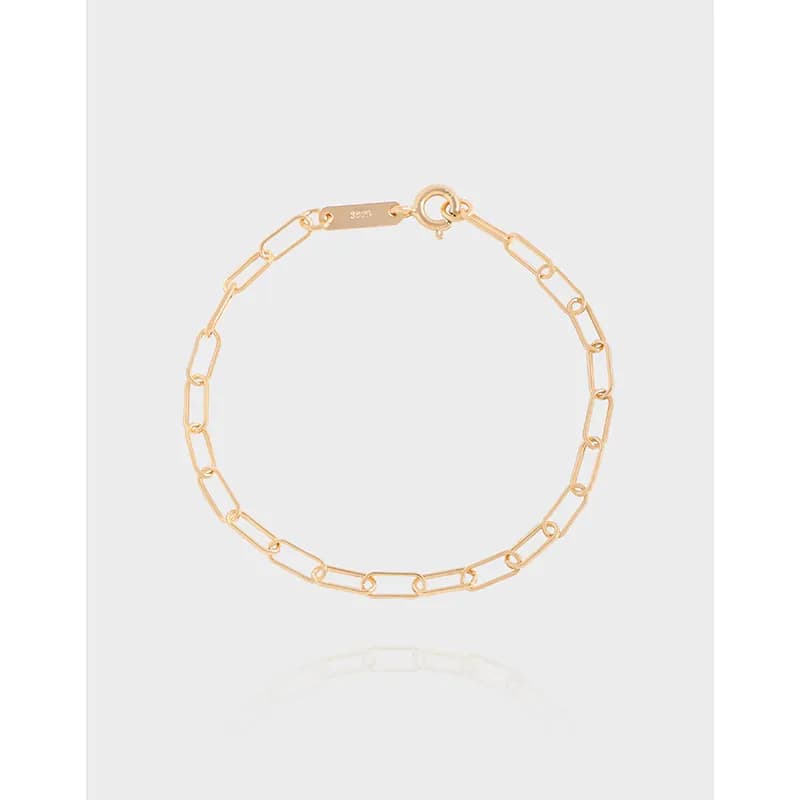 Polished sterling silver bracelet with elongated rectangular links and a lobster clasp on display.