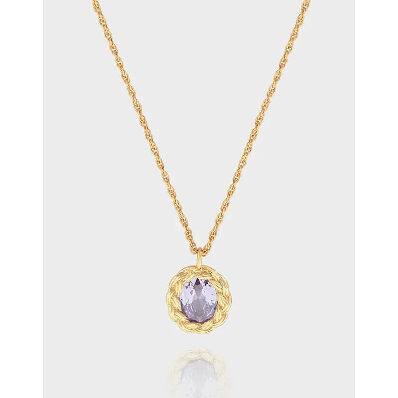 Lavender oval gemstone pendant with a braided halo on a delicate sterling silver chain.