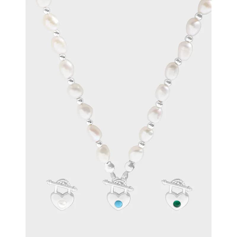 Sterling silver pearl necklace with three heart-lock pendants and small silver beads