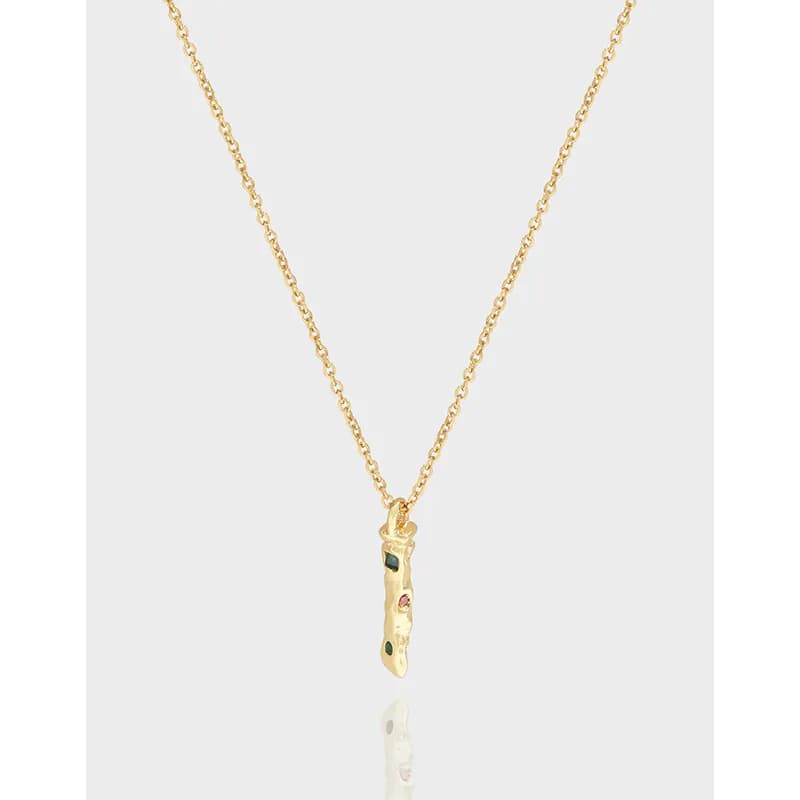 Polished sterling silver twig pendant on a delicate chain, shown against a light background.