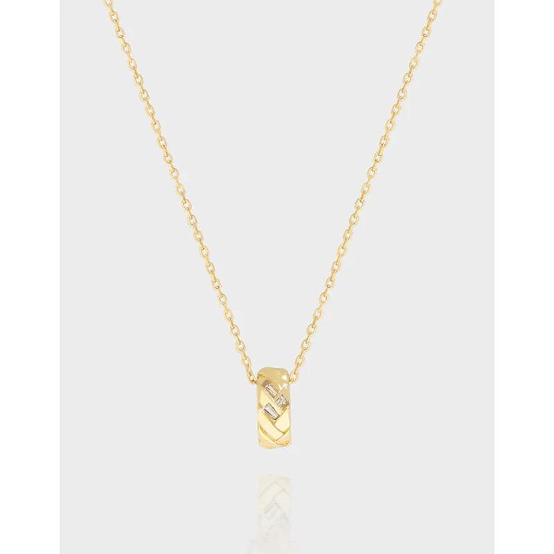 Polished sterling silver cylindrical pendant with diagonal grooves on a delicate chain