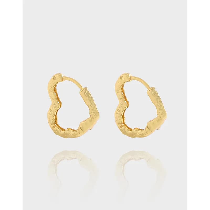 Gold-toned hammered hoop earrings with an irregular circular shape and polished surface.