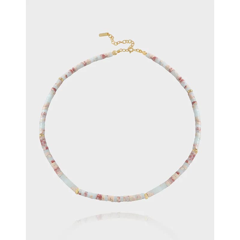 Polished sterling silver necklace with pastel blue and pink square beads and gold-tone spacers