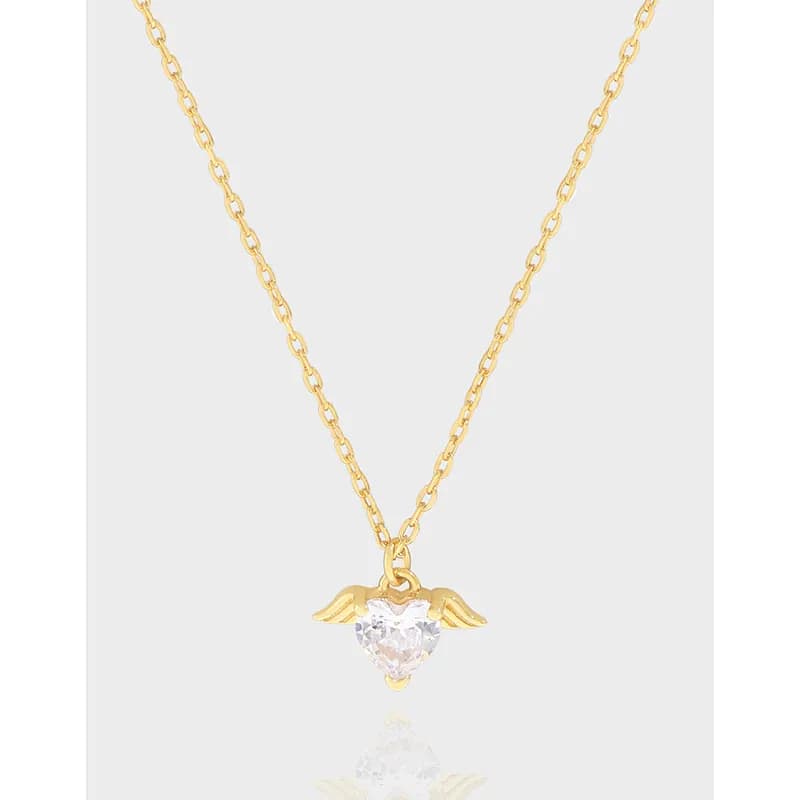 Delicate sterling silver necklace with a heart-shaped crystal pendant and small wings on a fine chain.