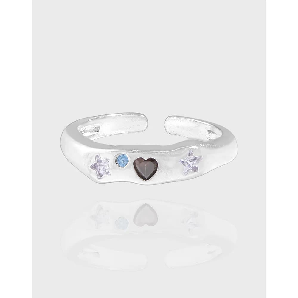Polished sterling silver open-ring with star and heart stones along the front.