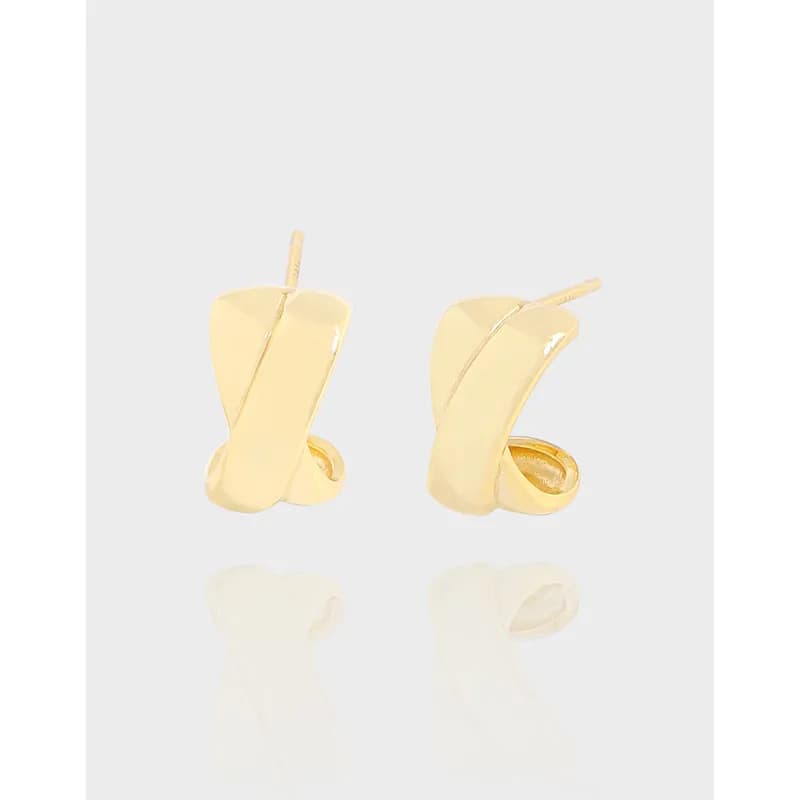 Polished curved sheet earrings in sterling silver with a diagonal seam detail.