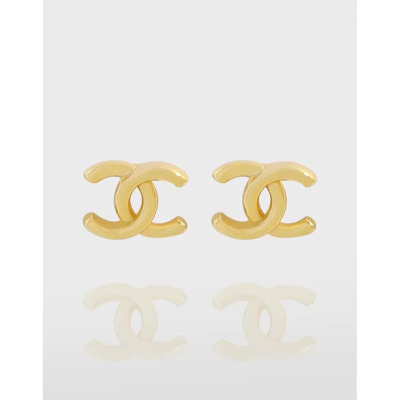 Polished sterling silver Interlocking C Logo stud earrings with a sleek, minimal design.