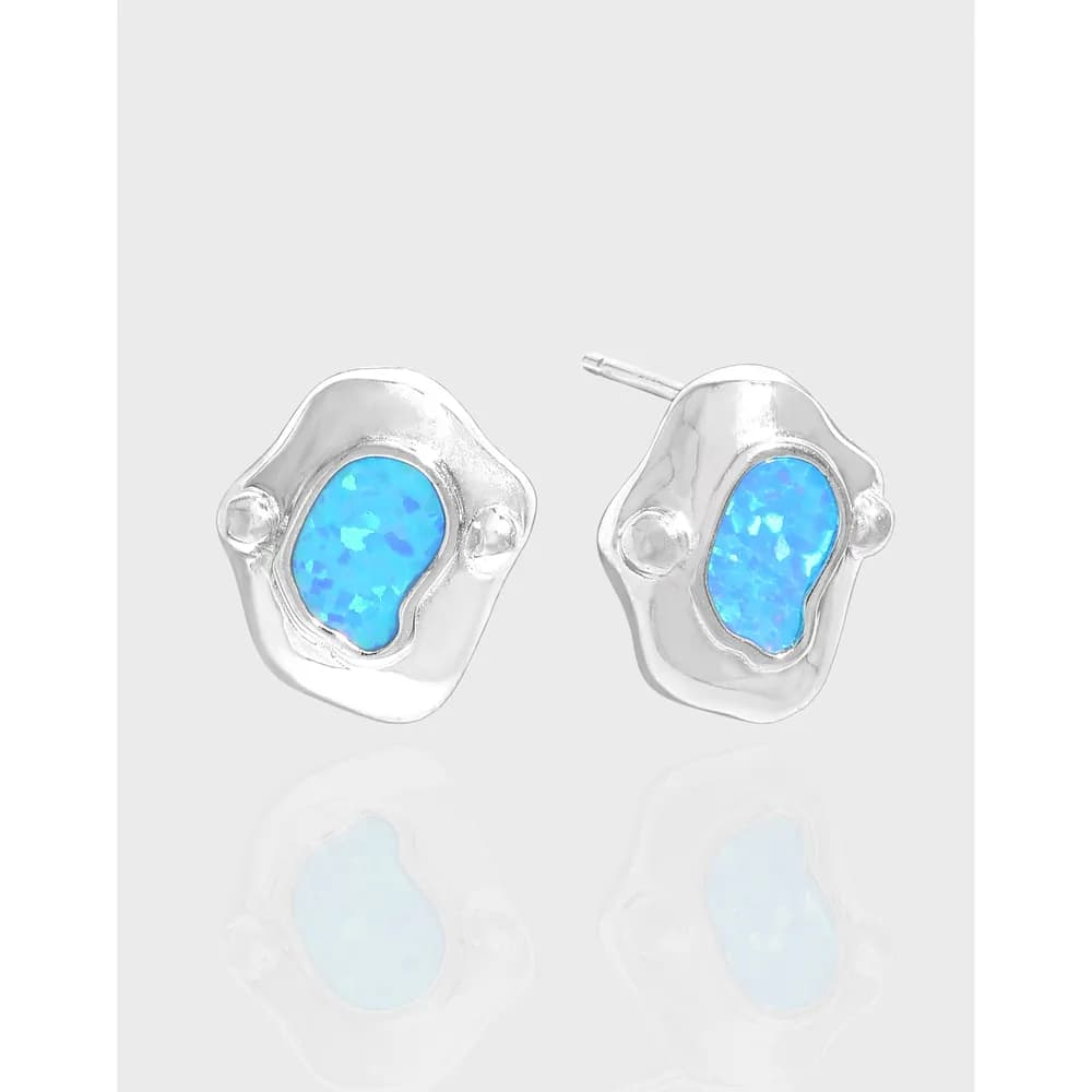 Sterling silver irregular blob stud earrings with a blue opal centerpiece