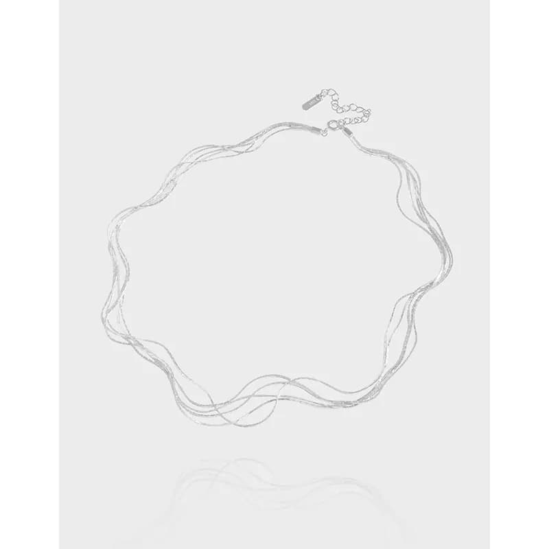 Polished sterling silver multi-strand wavy necklace with adjustable clasp laid flat