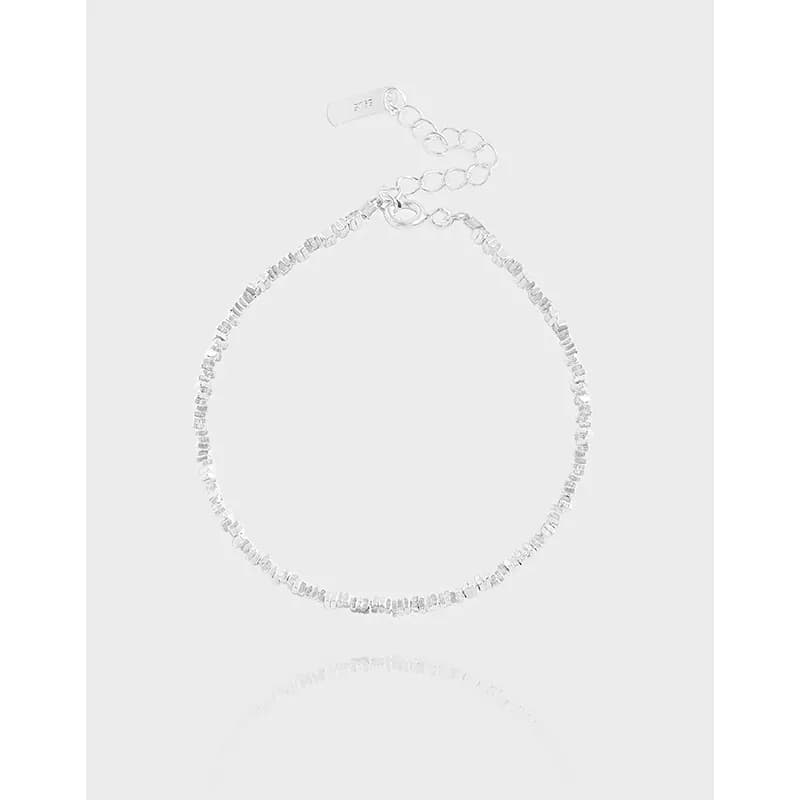 Polished sterling silver bracelet with tiny cube beads along a delicate chain