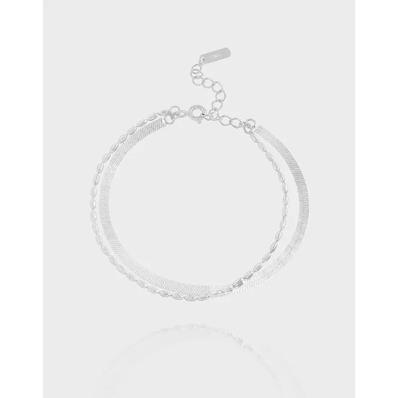 Two-tone-like parallel chains in polished sterling silver forming a bracelet with an extender clasp.
