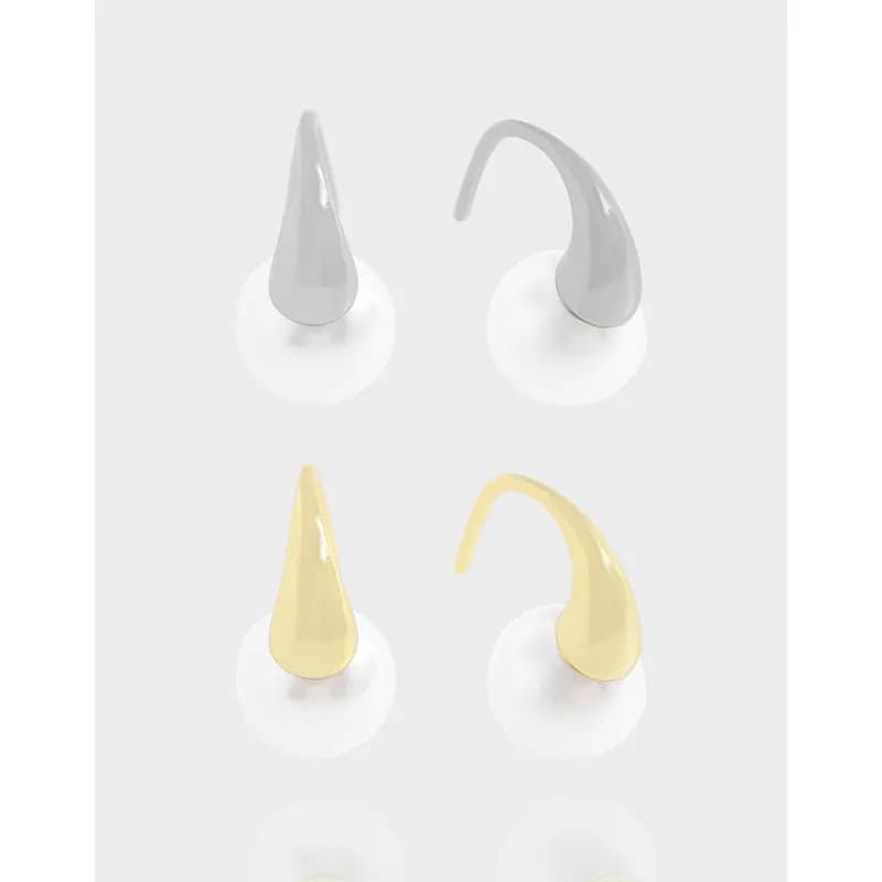 Polished cone-drop earrings with curved hooks in silver and gold-tone finishes.