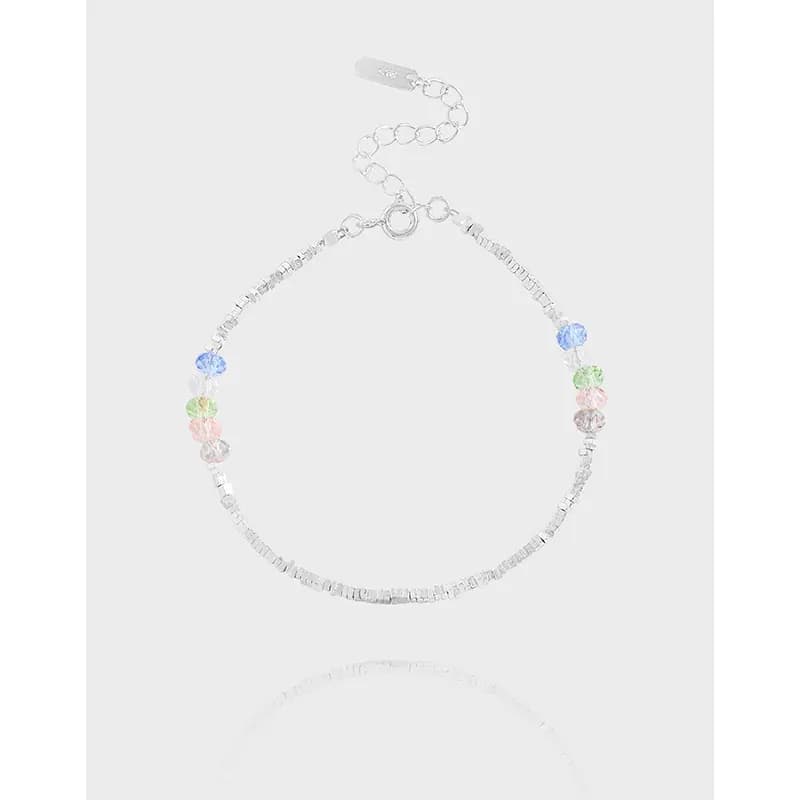 Polished sterling silver bracelet with square beads and pastel round beads along the chain.