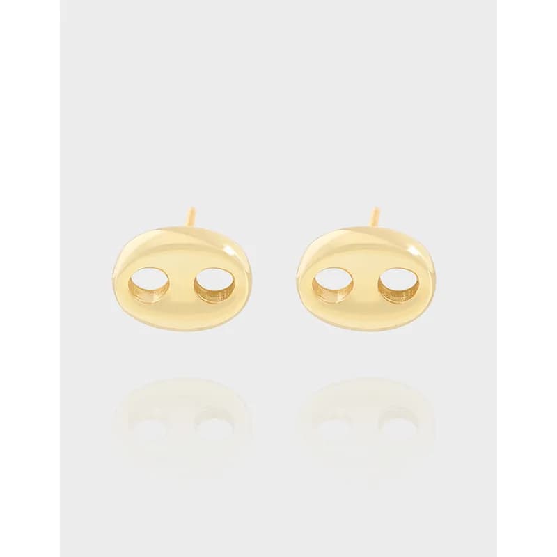 Polished sterling silver oval cutout stud earrings with two circular holes