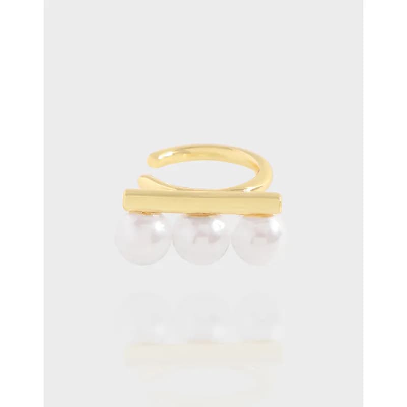 Polished sterling silver earrings with a horizontal bar and three pearls displayed on a white backdrop.