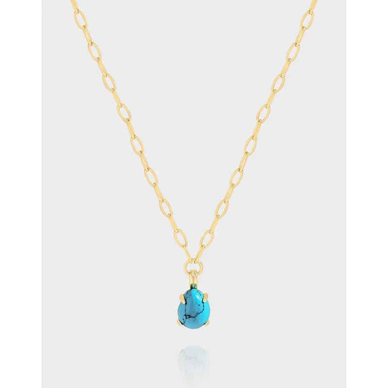 Polished sterling silver necklace with a turquoise cabochon pendant on elongated oval chain links