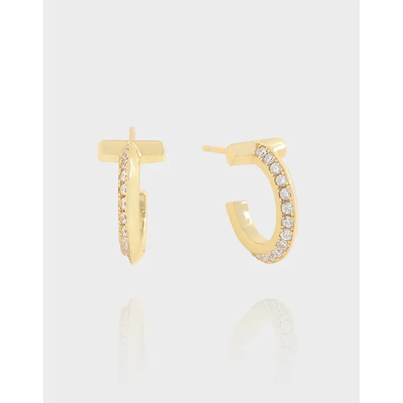 Polished sterling silver hoop earrings with a pavé of small stones along the outer edge
