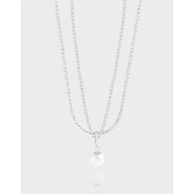 Two-layer sterling silver necklace with a pavé chain and a pearl pendant
