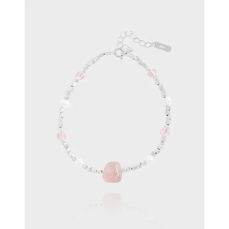 Polished sterling silver bead bracelet featuring a pink central stone with pink crystals and white pearl accents.