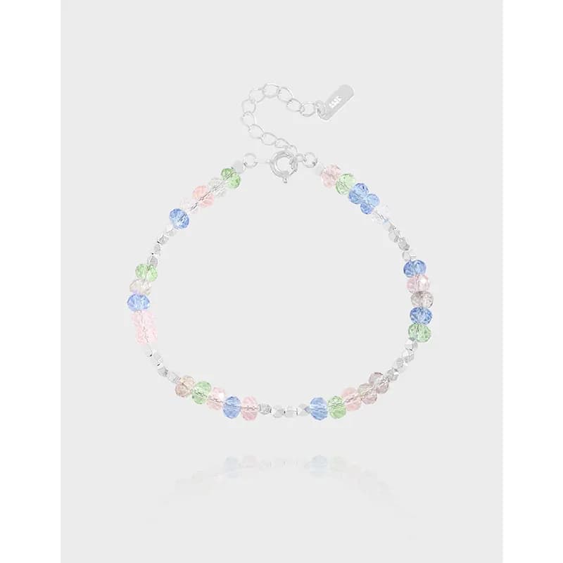 Sterling silver bracelet with pastel faceted beads and an adjustable extender chain.