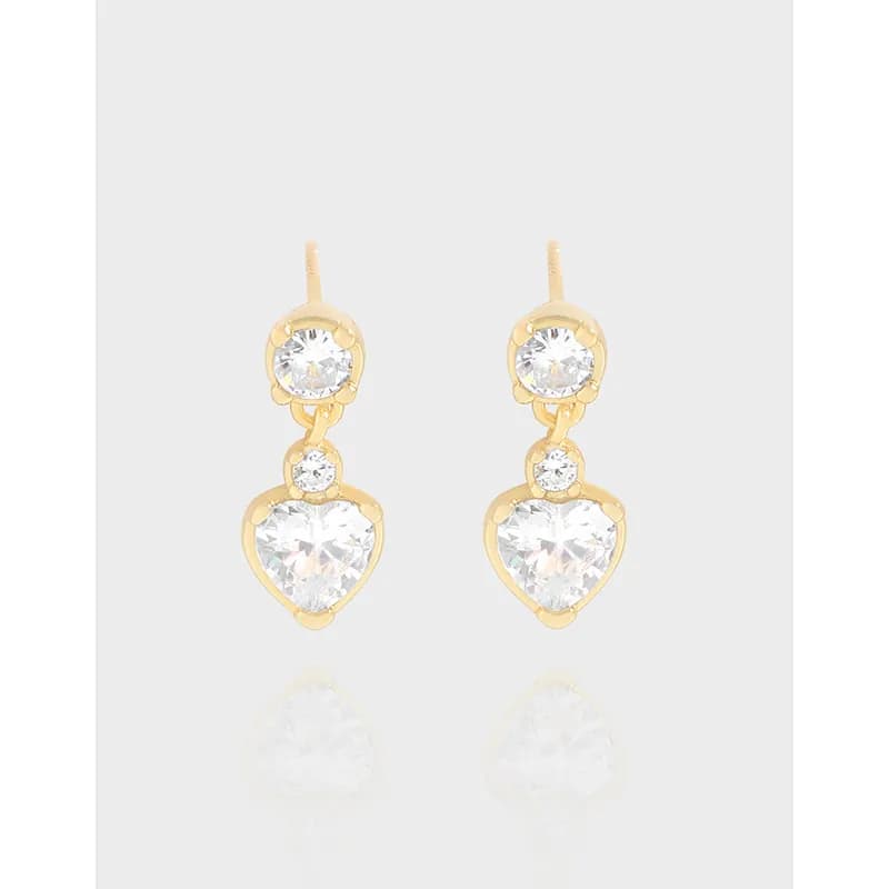 Polished sterling silver heart drop earrings with two clear stones hanging from posts.