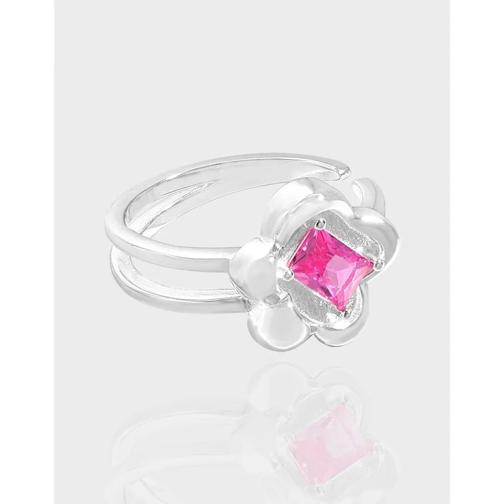 Sterling silver ring with a pink square-cut gemstone set in a flower-inspired design