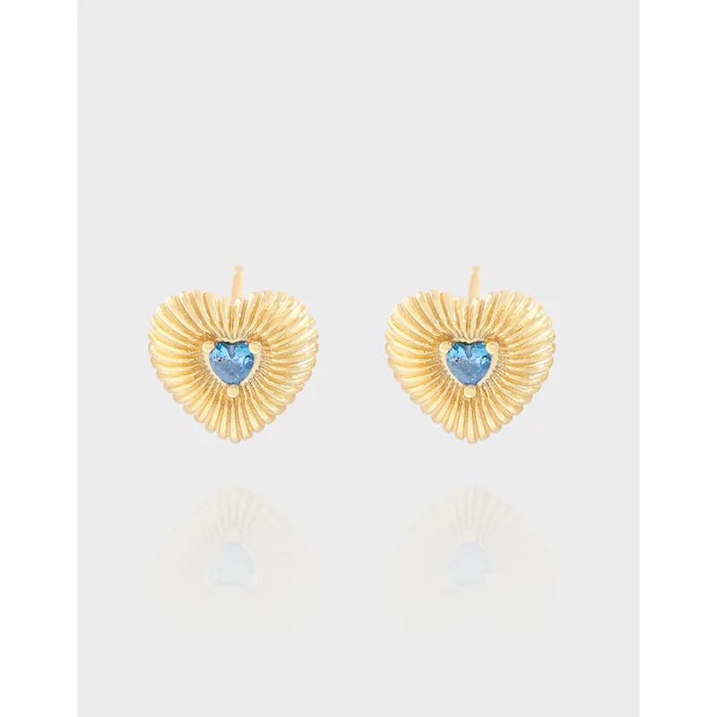 Gold-toned heart-shaped earrings with ribbed radiating pattern and a blue heart center
