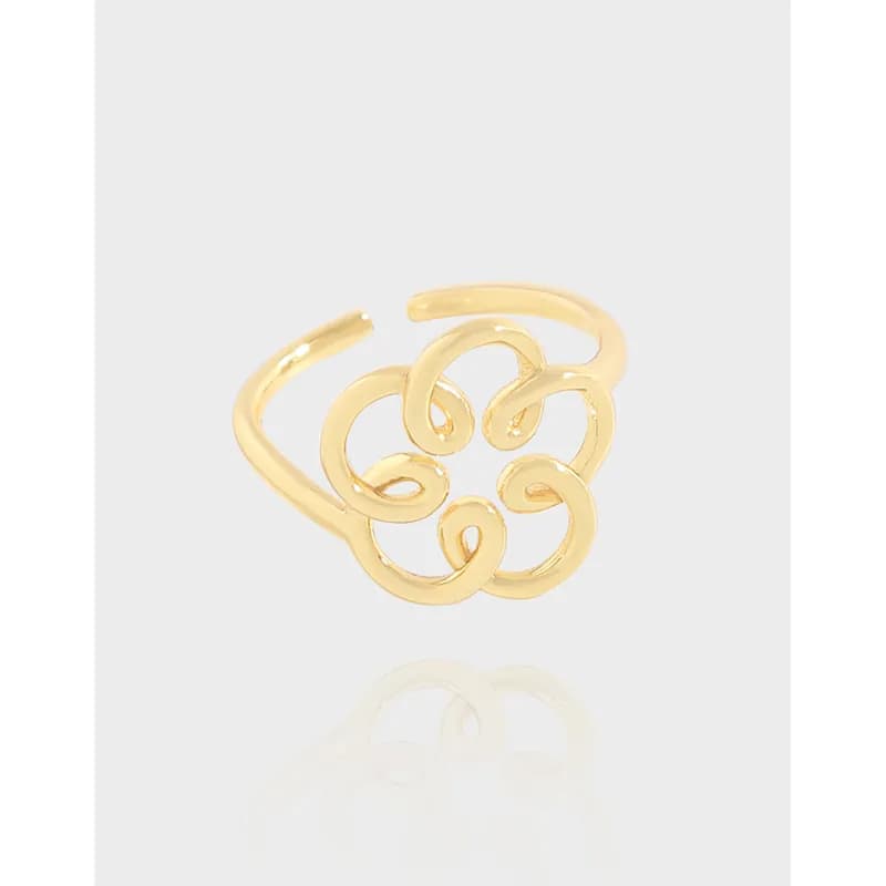 Polished sterling silver ring with a five-loop interlocking floral cluster on an open band.