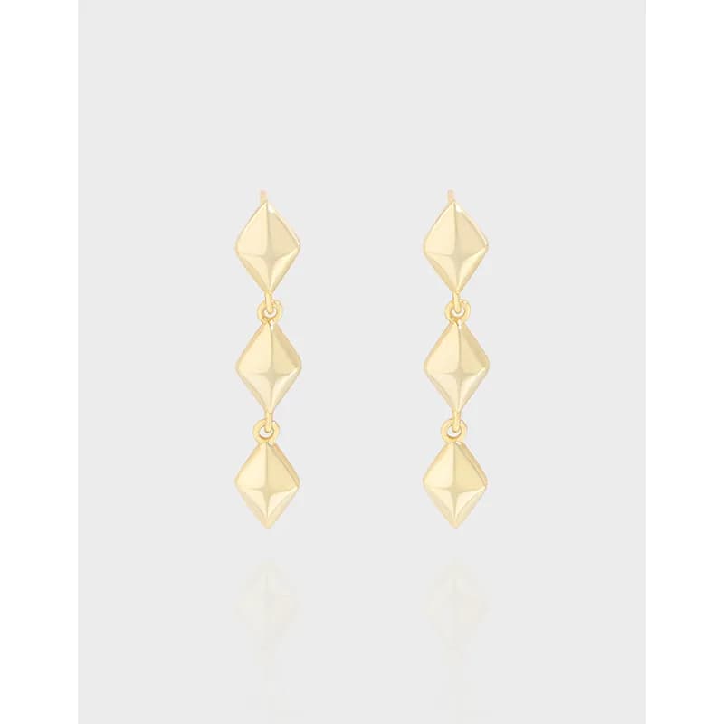 Polished sterling silver drop earrings with three linked diamond shapes in a vertical arrangement.