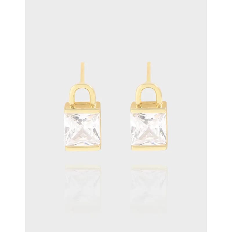 Pair of square-cut clear gemstone earrings in a gold-tone frame with a rounded arch and hook backing.