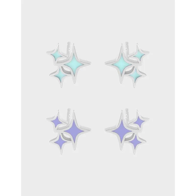 Pair of starburst enamel studs in silver with pastel blue and lavender enamel accents.