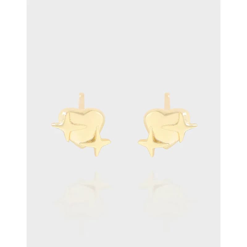 Polished silver star-and-heart stud earrings facing forward on a light background.