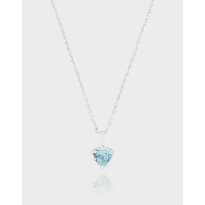 Sterling silver necklace with a heart-shaped blue gemstone pendant on a fine chain.