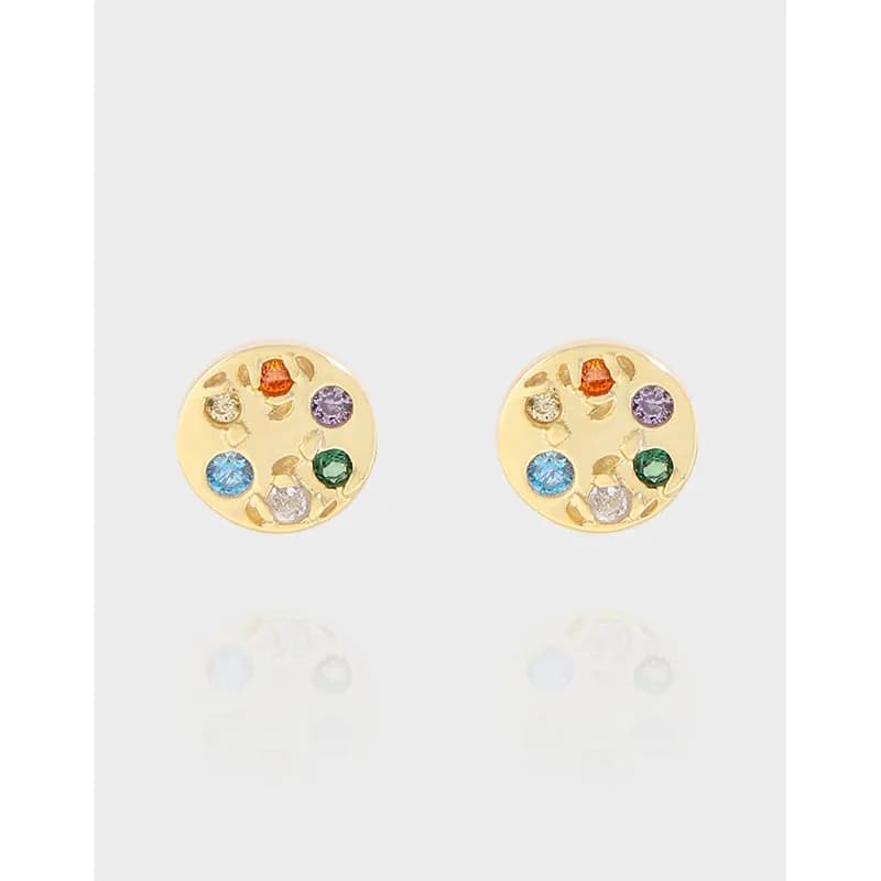 Polished sterling silver round disc earrings with colorful stones arranged around the edge.