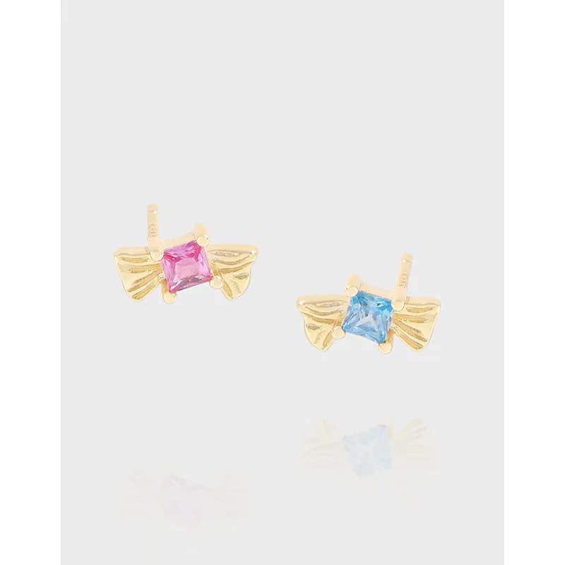 Polished sterling silver bow-shaped stud earrings with square pink and blue stones.