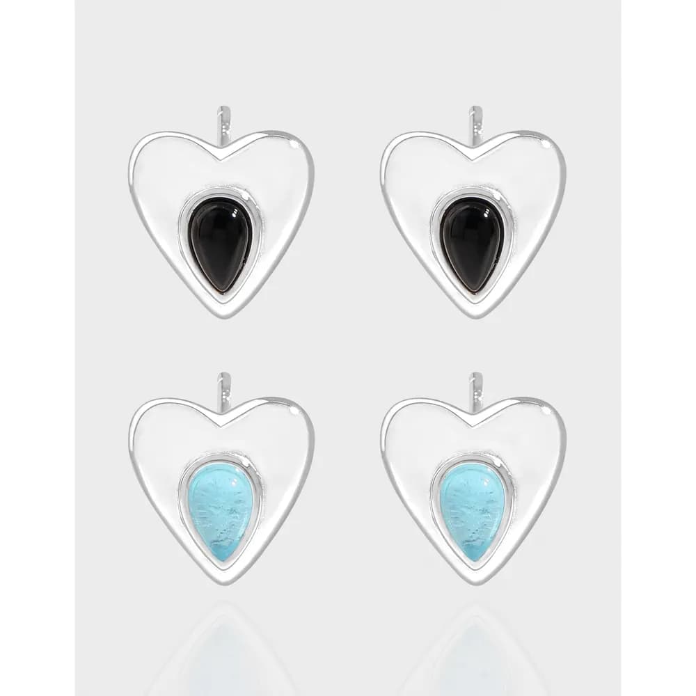 Polished sterling silver heart earrings with bezel-set teardrop stones in black and turquoise.