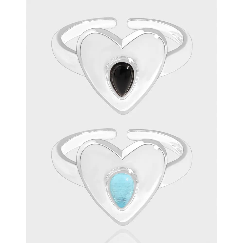 Polished sterling silver heart-shaped ring with a teardrop cabochon in a split-band design.