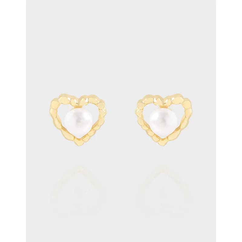 Polished sterling silver heart-shaped stud earrings with white pearls.