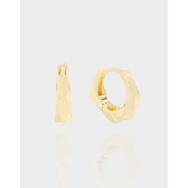 Polished sterling silver twisted hoop earrings with a chunky, organic shape