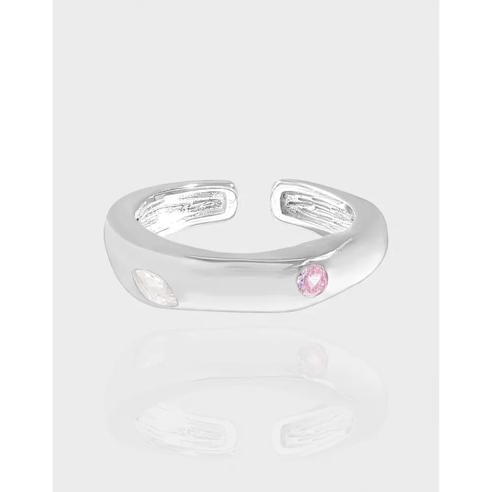 Polished sterling silver open ring with a pink gemstone and white accent stones