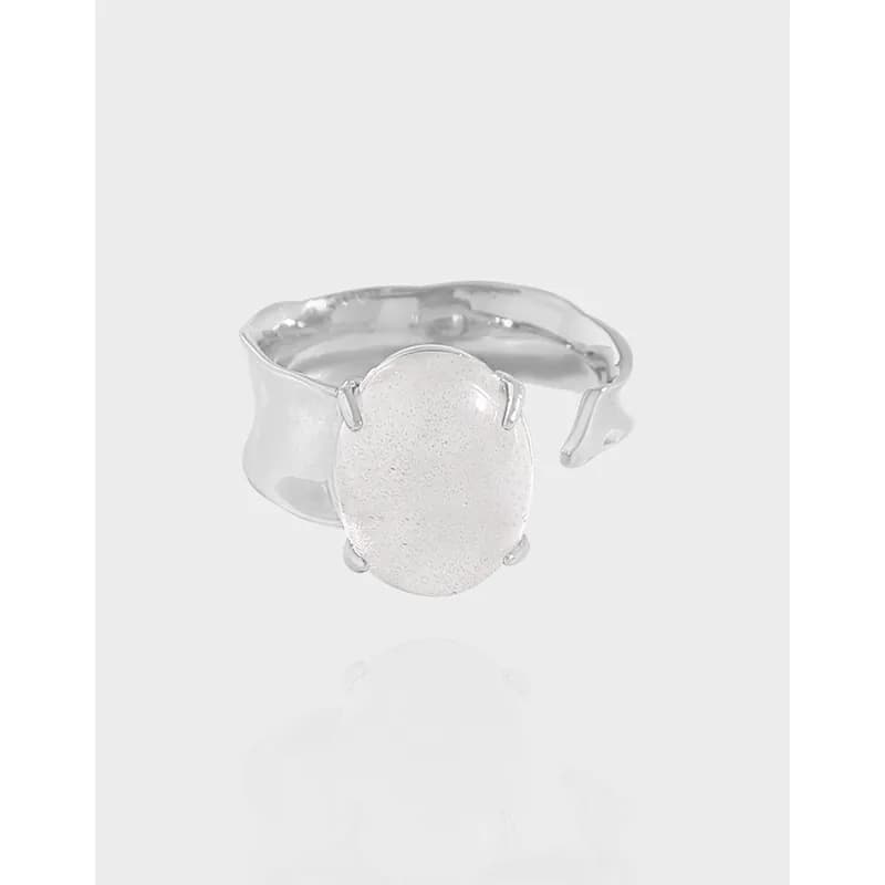 Polished sterling silver ring with an oval textured centerpiece