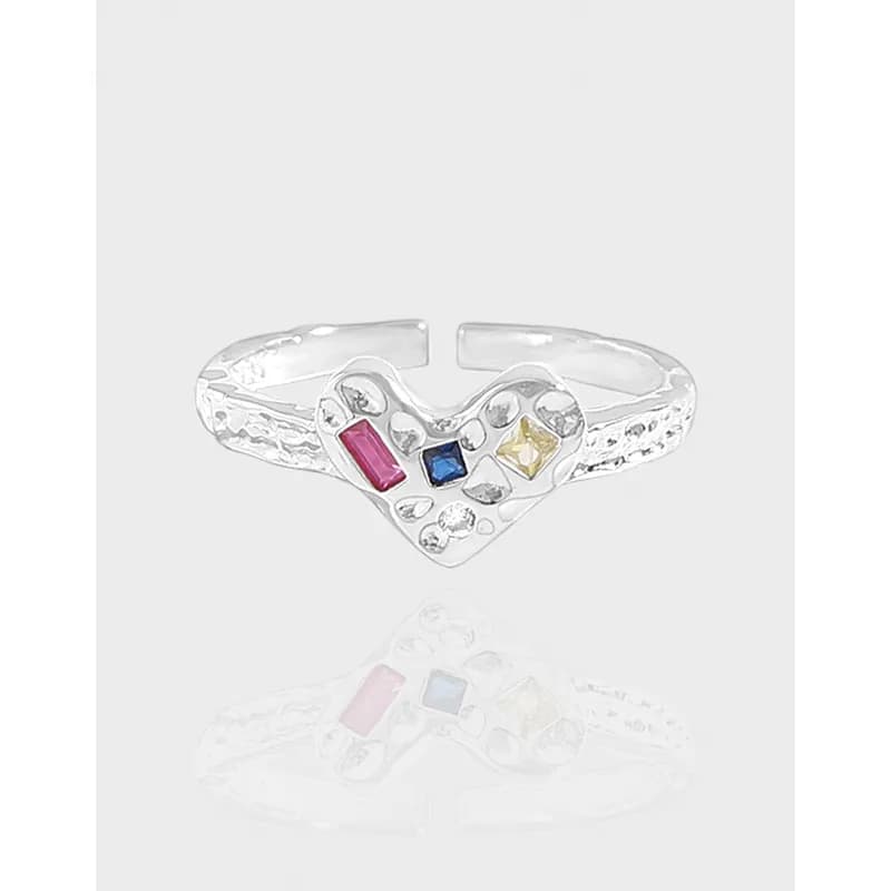 Polished sterling silver heart-shaped ring with colored rectangular stones and textured band.
