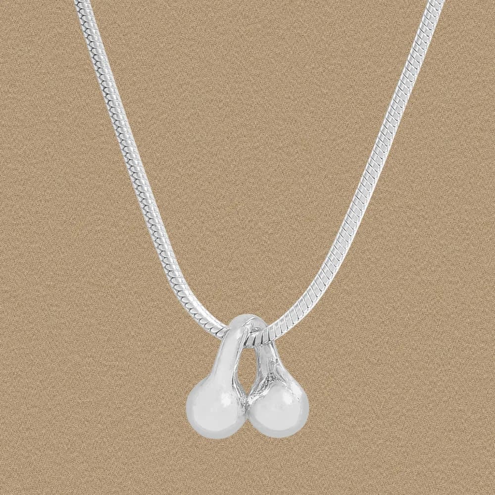 Polished sterling silver necklace with a twin pearl pendant on a fine chain