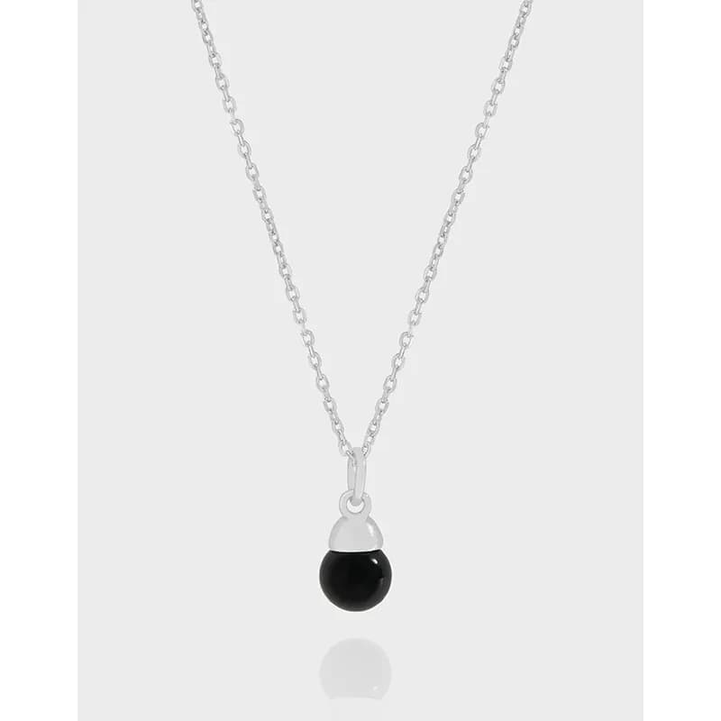 Sterling silver necklace with a black onyx bead pendant.